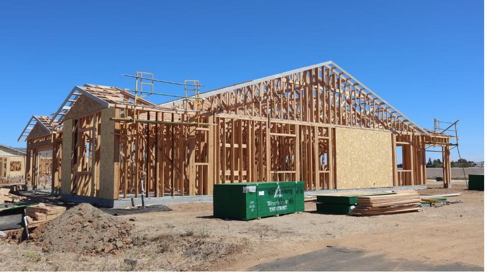 New home under construction with wood framing