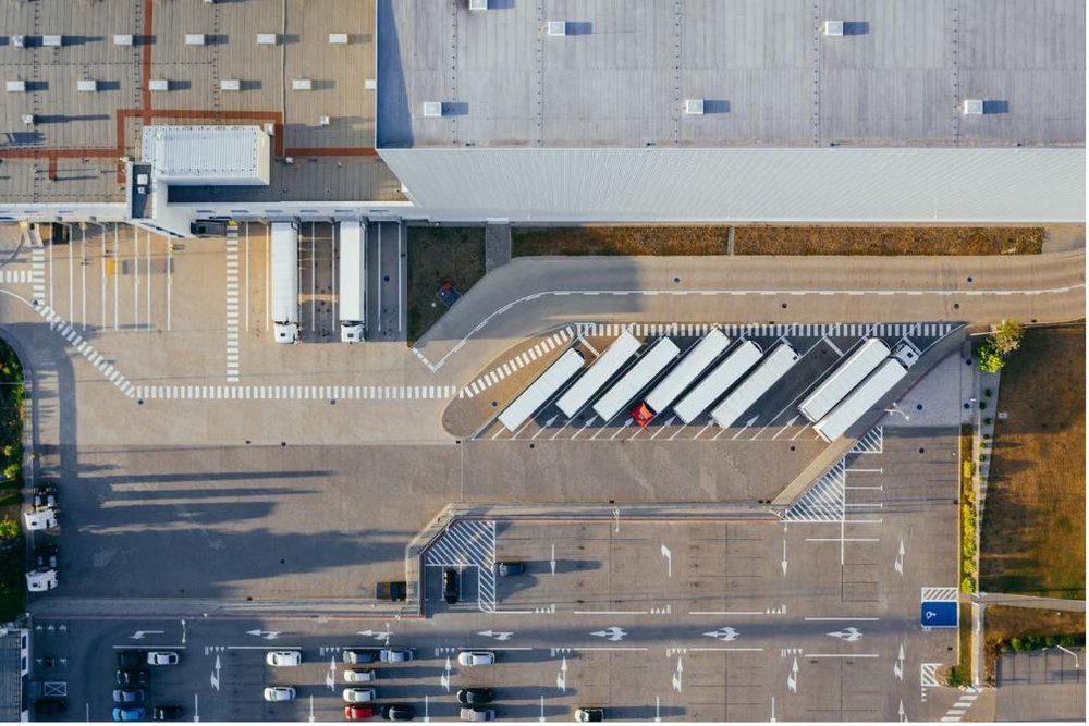 Aerial view of a warehouse and logistics facility with loading docks